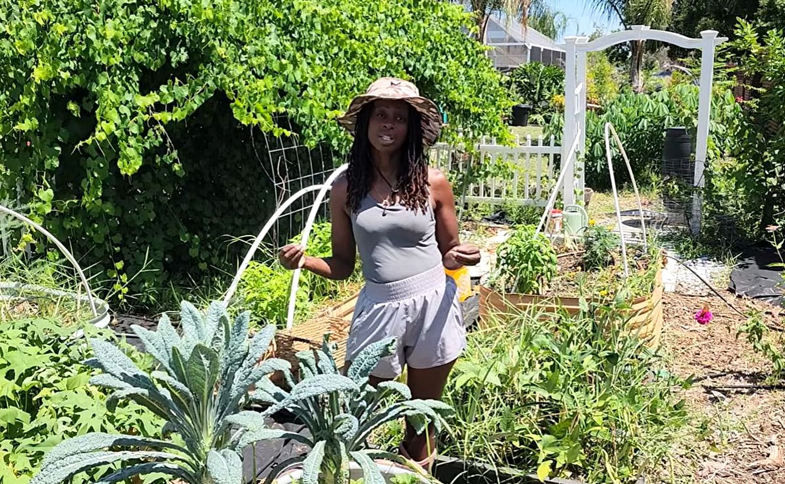 Toni in the GrowFitFL backyard garden
